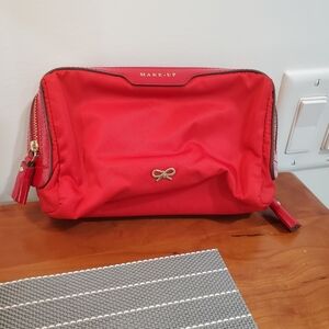 Red Anya Hindmarch Makeup Bag with Gold Accents